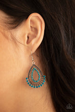 Load image into Gallery viewer, A fan of blue rhinestones flares out from the bottom of an ornately studded silver teardrop featuring an airy blue rhinestone ringed center. Earring attaches to a standard fishhook fitting.  Sold as one pair of earrings.  Always nickel and lead free.