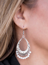Load image into Gallery viewer, Refreshing white beading swings from the bottom of a delicately hammered silver teardrop, creating a colorful fringe. Earring attaches to a standard fishhook fitting.  Sold as one pair of earrings.