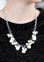 Load image into Gallery viewer, Clusters of large and small white pearls cascade from the bottom of a bold silver chain, creating a refined fringe below the collar. Features an adjustable clasp closure.  Sold as one individual necklace. Includes one pair of matching earrings.