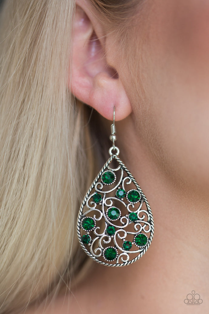 Varying in size, glittery green rhinestones are sprinkled along a silver filigree backdrop for a whimsical look. Earring attaches to a standard fishhook fitting.  Sold as one pair of earrings..  Always nickel and lead free. 