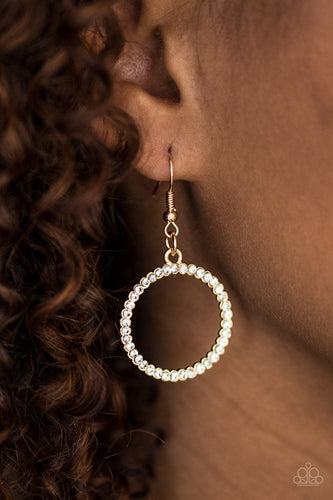 Glittery white rhinestones are encrusted along a shimmery gold hoop, creating a bubbly lure. Earring attaches to a standard fishhook fitting.  Sold as one pair of earrings.