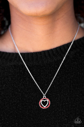 Encrusted in fiery red rhinestones, a shimmery silver heart pendant swings below the collar in a whimsical fashion. Features an adjustable clasp closure.  Sold as one individual necklace. Includes one pair of matching earrings.  Always nickel and lead free.