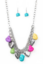 Load image into Gallery viewer, Multicolored faux rocks alternate with heart charms along a chunky silver chain. Hearts are inscribed with the phrase &quot;With All My Heart&quot; on one side and a short bible verse on the other that reads, &quot;Love the Lord thy God with all your heart. Luke 10:27.&quot; Layers of various chains add some edge. Features an adjustable clasp closure. Sold as one individual necklace. Includes one pair of matching earrings.