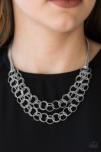 Necklace and Earrings:  Varying in size, rows of shiny silver rings interlock into two layered rows below the collar for an edgy industrial look. Features an adjustable clasp closure.  Bracelet:  Varying in size, rows of shiny silver rings interlock across the wrist for a bold industrial look. Features an adjustable clasp closure.