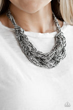Load image into Gallery viewer, Brushed in a flashy finish, countless strands of silver and gunmetal seed beads weave into a bulky square braid below the collar for a glamorous look. Features an adjustable clasp closure.  Sold as one individual necklace. Includes one pair of matching earrings.  Always nickel and lead free.