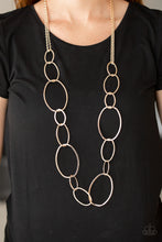 Load image into Gallery viewer, Swinging from doubled rose gold chains, oversized asymmetrical hoops dramatically link across the chest for a refined industrial look. Features an adjustable clasp closure.  Sold as one individual necklace. Includes one pair of matching earrings.  Always nickel and lead free.