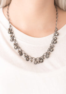 Faceted gunmetal beads and glittery hematite rhinestone encrusted frames swing from the bottom of a bold gunmetal chain, creating a sassy fringe below the collar. Features an adjustable clasp closure.  Sold as one individual necklace. Includes one pair of matching earrings.