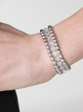 Load image into Gallery viewer, Classic silver beads and faceted white beading are threaded along three stretchy bands, creating refined layers across the wrist in a sleek fashion.  Sold as one set of three bracelets.  