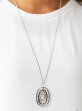 Load image into Gallery viewer, Threaded along a silver-beaded rod, mismatched silver, gunmetal, and shiny copper ovals ripple into a dizzying pendant at the bottom of a lengthened silver chain. Features an adjustable clasp closure.  Sold as one individual necklace. Includes one pair of matching earrings.