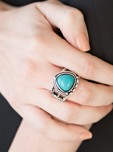 Chiseled into a triangular shape, a refreshing turquoise stone is pressed into the center of an ornate silver frame for a seasonal look. Features a stretchy band for a flexible fit.  Sold as one individual ring.