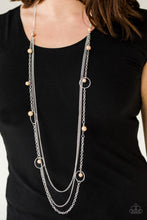 Load image into Gallery viewer,   Infused with two plain strands of shimmery silver chains, polished brown beads and shimmery silver hoops trickle along a bold silver chain for a whimsically layered look. Features an adjustable clasp closure.  Sold as one individual necklace. Includes one pair of matching earrings. Always nickel and lead free.