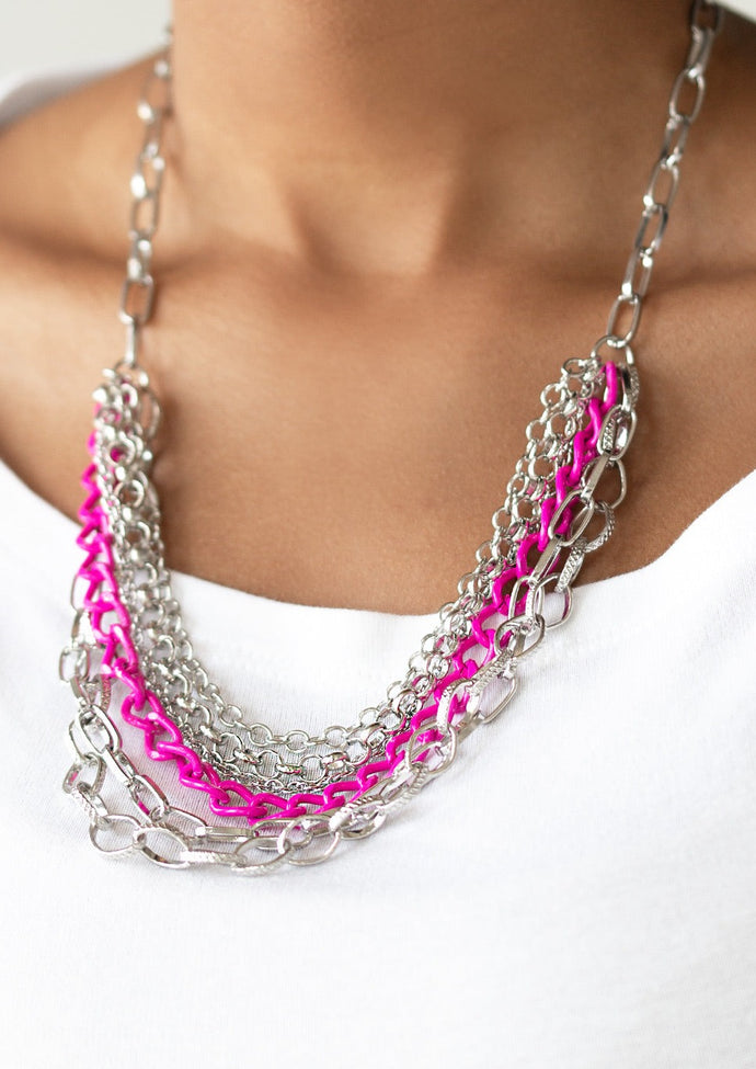 Mismatched silver chains layer below the collar for a bold industrial look. Painted in a flirty finish, a shiny pink chain drapes between the shimmery silver chains for a vivacious finish. Features an adjustable clasp closure.  Sold as one individual necklace. Includes one pair of matching earrings.