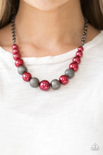 Load image into Gallery viewer,  Dusted in glitter, sparkling gunmetal and pearly red beads are threaded along an invisible wire below the collar for a glamorous look. Features an adjustable clasp closure.  Sold as one individual necklace. Includes one pair of matching earrings.  Always nickel and lead free.
