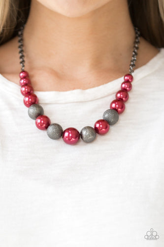  Dusted in glitter, sparkling gunmetal and pearly red beads are threaded along an invisible wire below the collar for a glamorous look. Features an adjustable clasp closure.  Sold as one individual necklace. Includes one pair of matching earrings.  Always nickel and lead free.