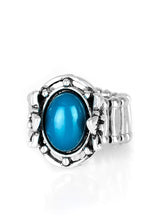 Load image into Gallery viewer, A polished blue bead is pressed into the center of a silver frame blooming with floral details for a whimsical finish. Features a stretchy band for a flexible fit.  Sold as one individual ring.  