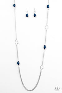 Faceted blue beads join shimmery silver teardrop frames along glistening silver chain for a colorfully casual look. Features an adjustable clasp closure.  Sold as one individual necklace. Includes one pair of matching earrings.