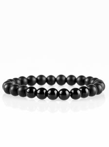 Brushed in a matte finish, glassy black beads are threaded along a stretchy elastic band for a seasonal look. A section of beads is brushed in a shiny finish for an earthy look.  Sold as one individual bracelet.  