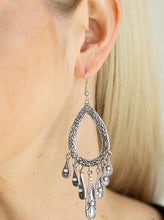 Load image into Gallery viewer, Dotted with dainty white beads, flared ornate silver beads swing from the bottom of a textured silver teardrop frame for a seasonal flair. Earring attaches to a standard fishhook fitting.  Sold as one pair of earrings.  