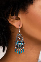 Load image into Gallery viewer, Dainty blue and gray beads are pressed into an ornate silver frame swirling with filigree detail. Dainty beaded tassels swing from the bottom of the lure, creating a whimsical fringe. Earring attaches to standard fishhook fitting.  Sold as one pair of earrings.
