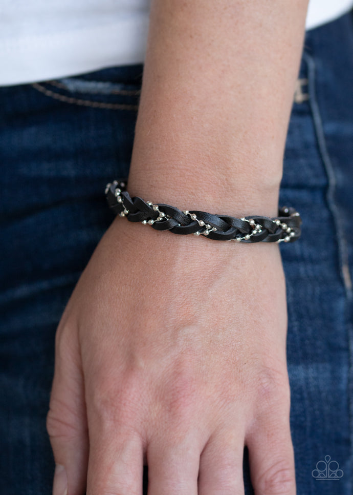 Strands of dainty silver ball chain weaves with black leather laces across the wrist, creating a rustic braid. Features an adjustable sliding knot closure.  Sold as one individual bracelet.  Always nickel and lead free. 