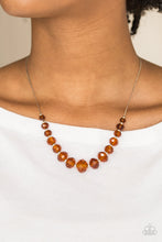 Load image into Gallery viewer, Glittery brown crystal-like beads and dainty silver beads are threaded along a flat silver chain below the collar. The sparkling crystal-like beads gradually increase in size near the center for a refined finish. Features an adjustable clasp closure.  Sold as one individual necklace. Includes one pair of matching earrings.  Always nickel and lead free.