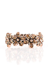 Load image into Gallery viewer, Encrusted in dainty topaz rhinestones, a trio of copper daisies connect across the finger, creating a whimsical band. Features a dainty stretchy band for a flexible fit.  Sold as one individual ring.