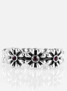 Glittery purple rhinestones are pressed into the centers of three shimmery silver daisies, creating a whimsical band across the finger. Features a dainty stretchy band for a flexible fit.  Sold as one individual ring.
