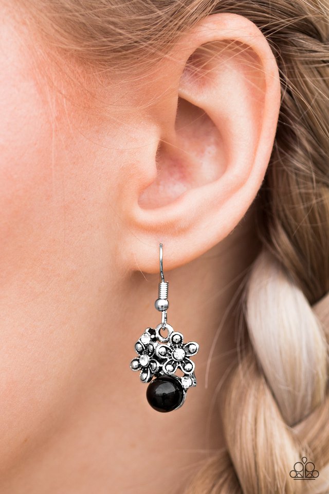 Sprinkled in shiny silver studs and glittery white rhinestones, shimmery silver flowers dance atop a black bead, creating a seasonal lure. Earring attaches to a standard fishhook fitting.  Sold as one pair of earrings.  Always nickel and lead free.