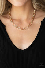 Load image into Gallery viewer, Pairs of joined gold links connect a collection of gold oval frames below the collar, creating an edgy chain. Features an adjustable clasp closure.  Sold as one individual necklace. Includes one pair of matching earrings.  Always nickel and lead free.  Fashion Fix Exclusive June 2021 