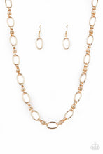 Load image into Gallery viewer, Pairs of joined gold links connect a collection of gold oval frames below the collar, creating an edgy chain. Features an adjustable clasp closure.  Sold as one individual necklace. Includes one pair of matching earrings.  Always nickel and lead free.  Fashion Fix Exclusive June 2021 