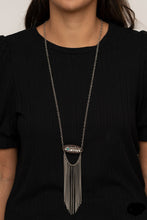 Load image into Gallery viewer, A fringe of silver chains swings from the bottom of a wooden frame adorned with a shimmery silver feather charm. Dotted with a refreshing turquoise stone, the whimsical pendant attaches to a lengthened silver chain for a free-spirited finish. Features an adjustable clasp closure.  Sold as one individual necklace. Includes one pair of matching earrings.  Always nickel and lead free.