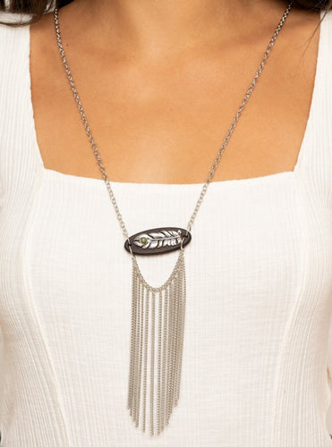 A fringe of silver chains swings from the bottom of a wooden frame adorned with a shimmery silver feather charm. Dotted with an earthy Military Olive stone, the whimsical pendant attaches to a lengthened silver chain for a free-spirited finish. Features an adjustable clasp closure.  Sold as one individual necklace. Includes one pair of matching earrings.  Always nickel and lead free.