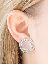 Load image into Gallery viewer, A dewy pink moonstone is pressed into a white rhinestone encrusted frame for a glamorous look. Earring attaches to a standard clip-on fitting.  Sold as one pair of clip-on earrings.
