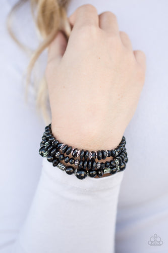  Varying in shape and shimmer, shiny black beads are threaded along three elastic stretchy bands. Infused with dainty silver accents, the colorful bracelets stack across the wrist for a refined look.  Sold as one set of three bracelets.  Always nickel and lead free. 