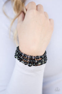  Varying in shape and shimmer, shiny black beads are threaded along three elastic stretchy bands. Infused with dainty silver accents, the colorful bracelets stack across the wrist for a refined look.  Sold as one set of three bracelets.  Always nickel and lead free. 