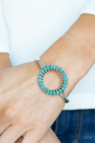 Chiseled into tranquil teardrops, earthy turquoise stones spin around the center of an antiqued silver cuff for a seasonal look.  Sold as one individual bracelet.  Always nickel and lead free.