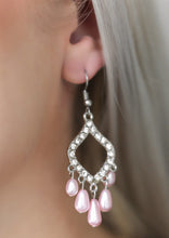 Load image into Gallery viewer, Encrusted in glassy white rhinestones, a shimmery silver frame gives way to a pearly pink fringe for an elegant fashion. Earring attaches to a standard fishhook fitting.  Sold as one pair of earrings.  