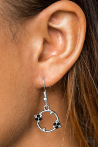 Glittery black rhinestones dot a dainty silver hoop, creating a bubbly lure. Earring attaches to a standard fishhook fitting.  Sold as one pair of earrings.  Always nickel and lead free.