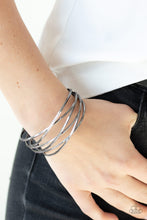 Load image into Gallery viewer, Shiny gunmetal wires crisscross across the wrist, coalescing into an edgy cuff.  Sold as one individual.  Always nickel and lead free.