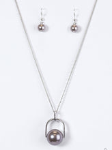 Load image into Gallery viewer, Brushed in a pearlescent shimmer, an oversized gray bead is pinched between a glistening silver frame, creating the illusion of a floating pearl for a dramatic look. Features an adjustable clasp closure.  Sold as one individual necklace. Includes one pair of matching earrings.