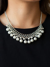 Load image into Gallery viewer, Tiers of dainty silver heart charms, dainty white pearls, and larger white pearls cascade below the collar, creating a flirtatiously layered fringe. Features an adjustable clasp closure.  Sold as one individual necklace. Includes one pair of matching earrings.