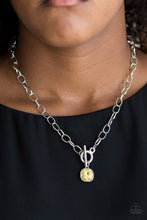 Load image into Gallery viewer, Pressed into a sleek silver frame, a dramatic yellow gem swings from the bottom of a glistening silver chain below the collar for a chic look. Features a toggle closure.  Sold as one individual necklace. Includes one pair of matching earrings.  Always nickel and lead free. 
