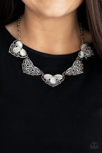 Load image into Gallery viewer, Filled with lacy-like patterns, filigree filled silver frames connect below the collar. Glowing white teardrop moonstones alternate along the airy frames, adding a refreshing hint of color to the whimsical fringe. Features an adjustable clasp closure.  Sold as one individual necklace. Includes one pair of matching earrings. Always nickel and lead free.