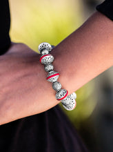 Load image into Gallery viewer, Enchanting silver beads and red stone accents are threaded along a stretchy elastic band, creating a seasonal look around the wrist.  Sold as one individual bracelet. 
