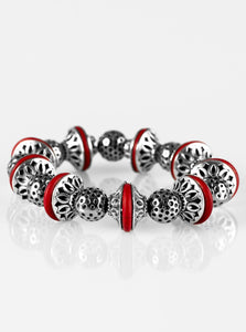 Enchanting silver beads and red stone accents are threaded along a stretchy elastic band, creating a seasonal look around the wrist.  Sold as one individual bracelet.