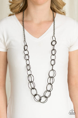 Gradually increasing in size, a collection of bold gunmetal hoops link to a dramatically interconnected chain for a statement-making look. Features an adjustable clasp closure.  Sold as one individual necklace. Includes one pair of matching earrings.  Always nickel and lead free.