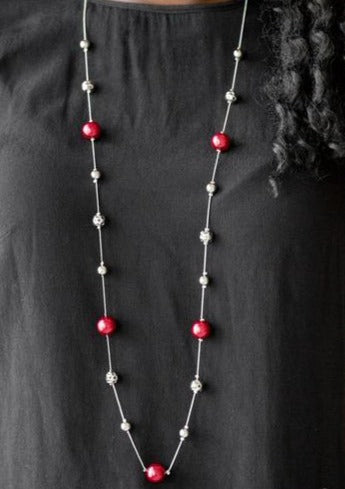 Infused with pearly red accents, classic silver and delicately hammered silver beads trickle along an elegantly elongated silver chain for a refined look. Features an adjustable clasp closure.  Sold as one individual necklace. Includes one pair of matching earrings.  Always nickel and lead free.