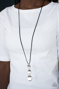 Delicately hammered in a glistening shimmer, asymmetrical silver frames link at the bottom of a lengthened black suede strand for a bold artisanal look. Features an adjustable clasp closure.  Sold as one individual necklace. Includes one pair of matching earrings.   Always nickel and lead free.