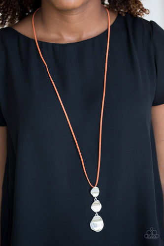 Delicately hammered in a glistening shimmer, asymmetrical silver frames link at the bottom of a lengthened orange suede strand for a bold artisanal look. Features an adjustable clasp closure.  Sold as one individual necklace. Includes one pair of matching earrings.  Always nickel and lead free.