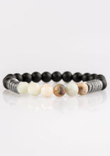Load image into Gallery viewer, Infused with antiqued metallic accents, smooth black and energetic natural stone beads are threaded along a stretchy elastic band for a seasonal look.